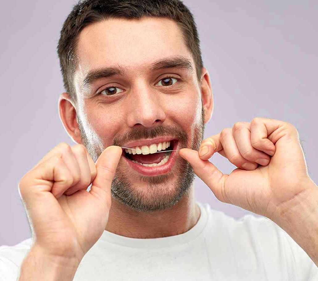 https://brushfamilydent.com/wp-content/uploads/2024/04/man-flossing3.jpg